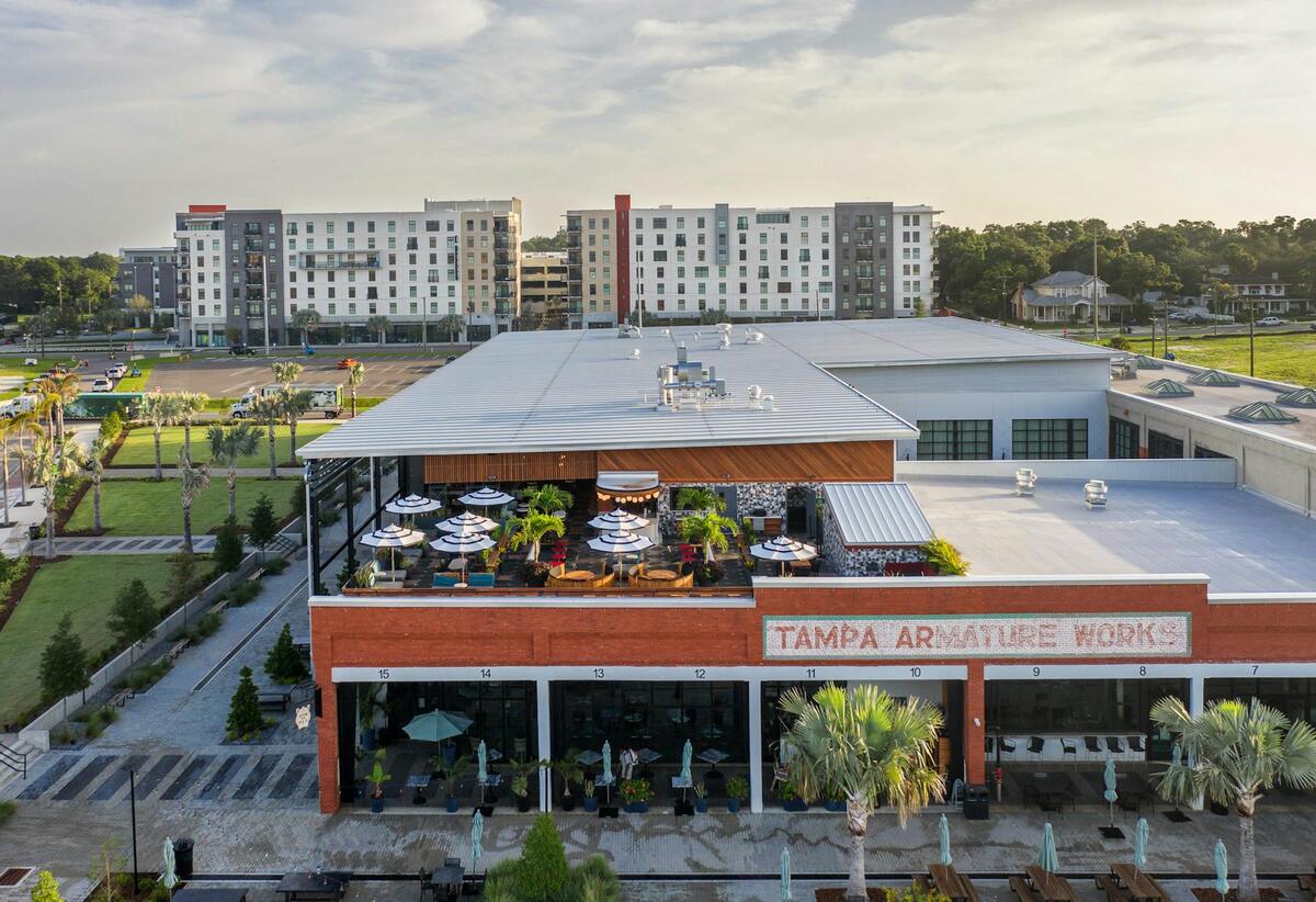 Best Rooftop Bars in Tampa, FL: Skyline Views and Sunset Cocktails 2 Aerial exterior view of M.Bird above Armature Works in Tampa, Florida