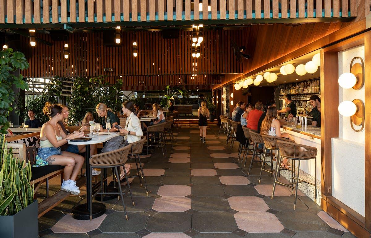Best Rooftop Bars in Tampa, FL: Skyline Views and Sunset Cocktails 3 Interior bar and dining area at M.Bird in Tampa, Florida
