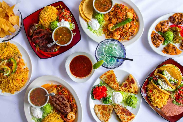 Best Mexican Restaurants in Tampa, FL: Four Local Places to Try 7 Assorted Mexican dishes, tacos, fajitas, rice, beans, and margarita from Miguel's in Tampa